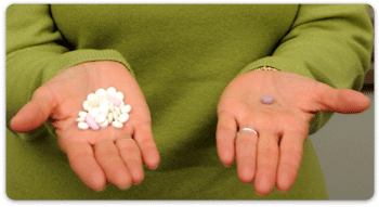 One hand with lots of tablets, the other with one